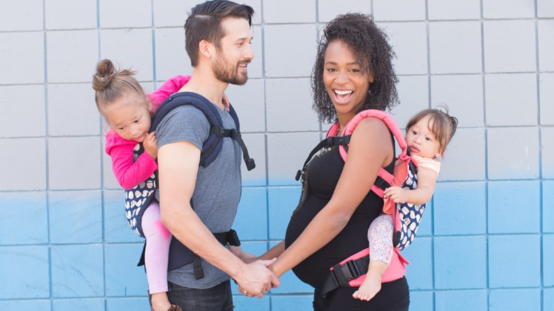 Babywearing-While-pregnant-mom-and-dad